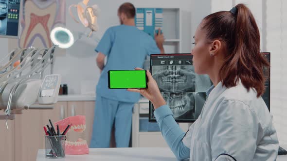 Woman Working with Horizontal Green Screen on Mobile Phone