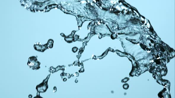 Water pouring and splashing in ultra slow motion 1500fps on a reflective surface - WATER POURS  alt