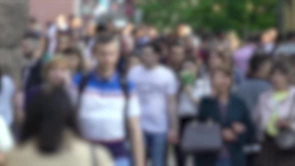 Silhouettes of People Walking in a Crowd Slow Motion