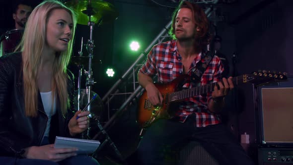 Female musician rehearsing before performing