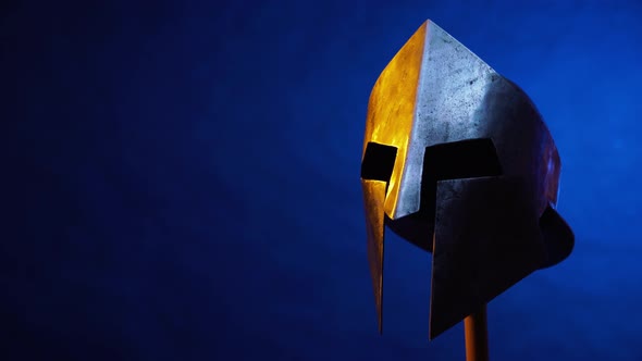 Old Spartan Helmet Isolated on Blue