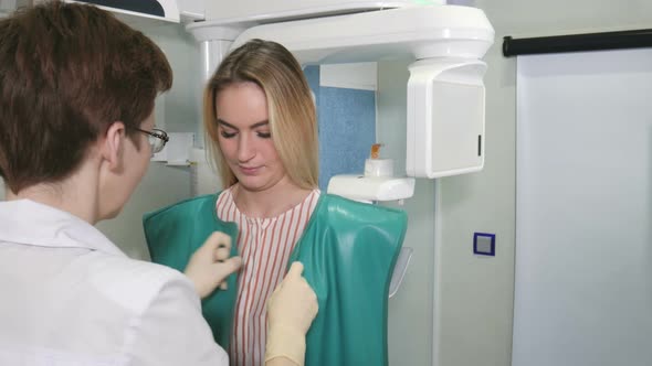 Female Patient Undergoes Panoramic Skull Scan of Teeth