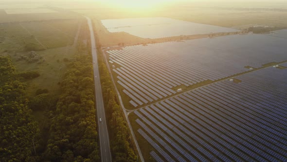 Aerial Top View of Solar Farm with Sunlight Cells for Producing Renewable Electricity