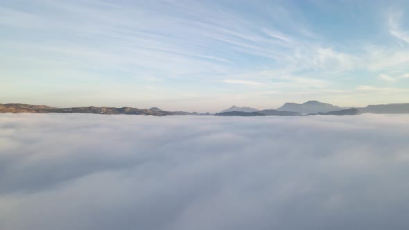 Aerial view of False bay covered in low cloud sunrise, Simonstown, Cape Town, South Africa.