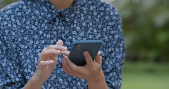 Woman use of smart phone in the park