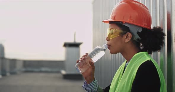 Woman Engineer with a Helmet and Safety