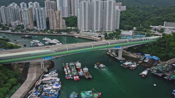 Aerial drone view of Chinese modern river bridge in Aberdeen, Hong Kong.