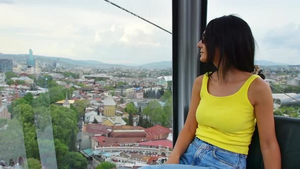 Caucasian Woman In Tbilisi Cable Car