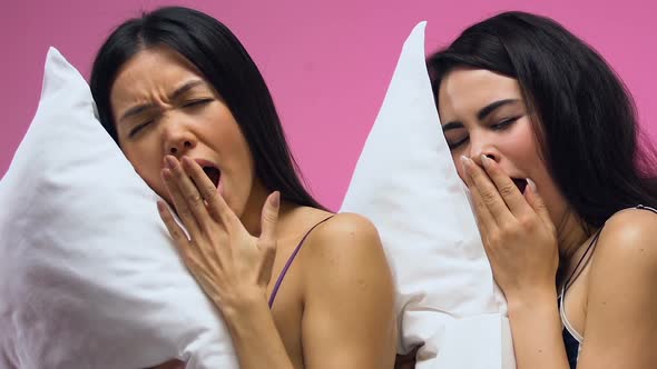 Attractive Women in Pajamas Yawning and Sleeping on Pillows, Sweet Dreams