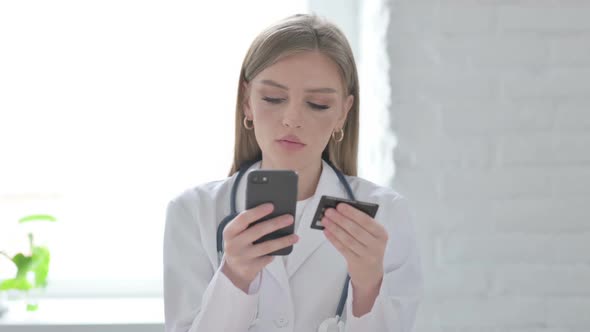 Portrait of Lady Doctor Making Successful Online Payment on Smartphone