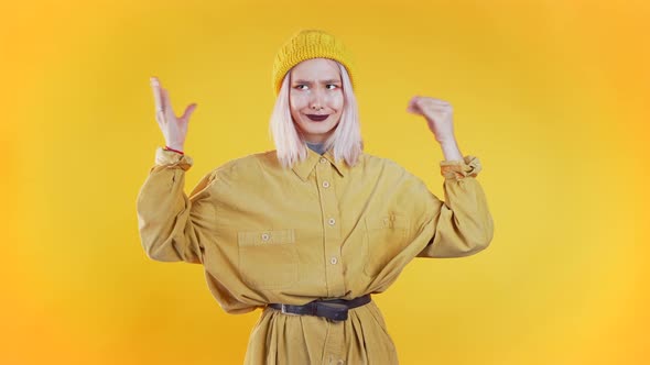 Pretty Millenial Girl Showing with Hands and Two Fingers Like Quotes Gesture