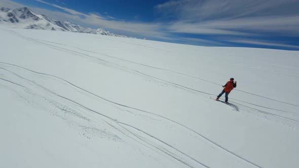 Aerial View Fpv Drone Male Riding on Snowboard Enjoy Extreme Sport at Ski Resort Winter Landscape