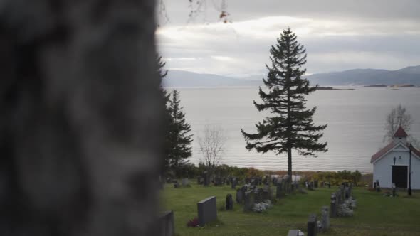 Wooden Church Graveyard By Fjord