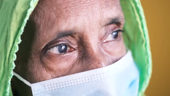 Portrait of an Old Indian Woman Wearing a Surgical Mask