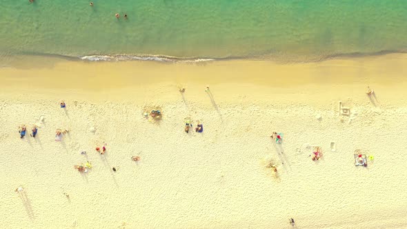 Beautiful water on Kata Noi beach. Drone 4K View of Kata Noi Beach, Phuket, Thailand. Aerial people