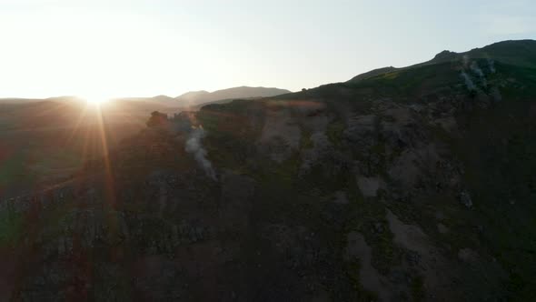 Orbit Around Rocky Formations with Hot Water Steaming Holes in Iceland