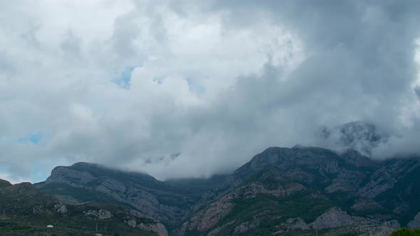 Clouds Over the Mountains on a Sunny Day Time Lapse