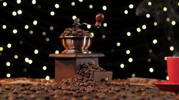 Coffee Mill and Red Cup on Saucer with Hot Drink