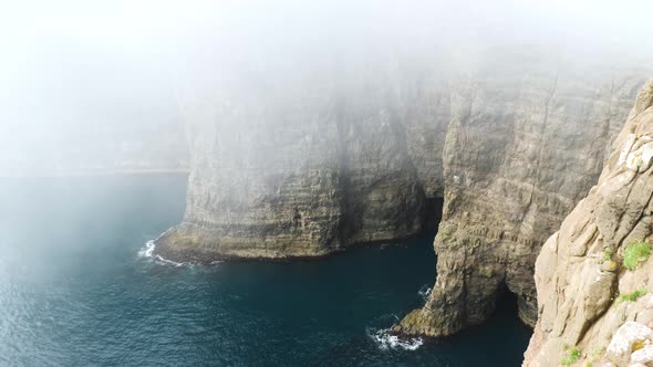 Beautiful View of Foggy Traelanipan Slave Mountain in Vagar Faroe Islands