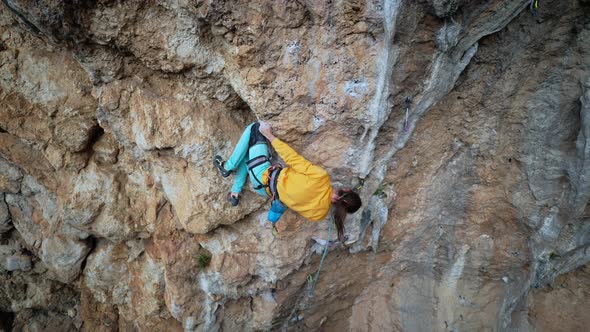 Slow Motion Back View Man Rockclimber Climbs on Overhanging Crag