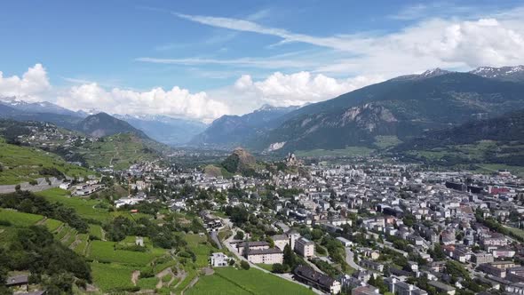 View from a drone of the beautiful city of Sion in the mountains in southern Switzerland, beautiful