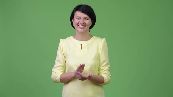 Beautiful Businesswoman with Short Hair Clapping Hands