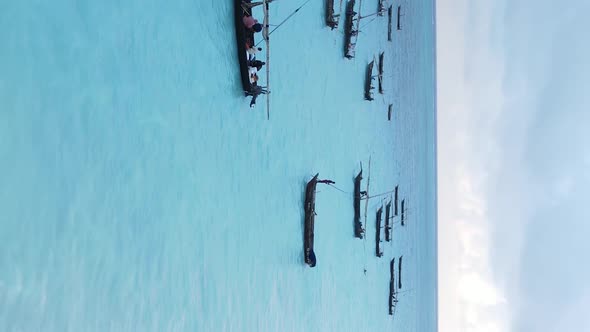 Vertical Video Boats in the Ocean Near the Coast of Zanzibar Tanzania Aerial View