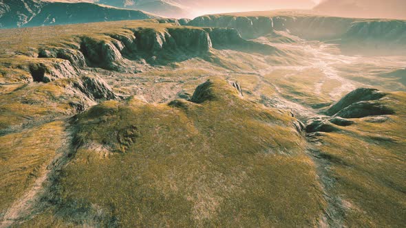 Landscape with Mountains and Dry Yellow Grass in New Zealand