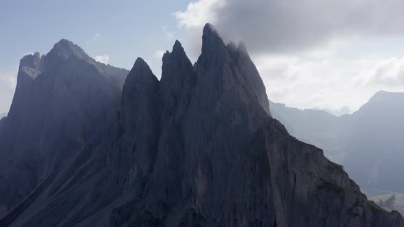 Aerial Shot of Italian Mountain Seceda with Fog Surrounding It