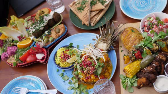 Top View of Assorted Healthy Vegan Options From Global Cuisines. Middle Eastern Meze, Indian Curry