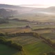 Aerial drone fly over farm fields and Kacwin village in Polish mountains at sunrise. - VideoHive Item for Sale