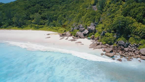 Drone Side Flight Above Turquoise Crystal Clear Ocean Water and Powerful Surf on Tropical Paradise