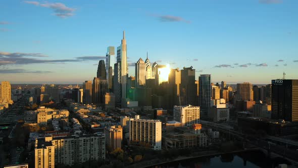 Aerial drone pull away view of the downtown Philadelphia skyline featuring tall, glass skyscrapers a