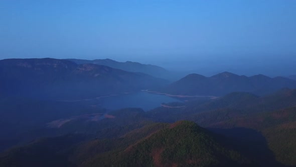 Epic Aerial Flight Over Sunrise in Autumn Mountains Morning Fog Background