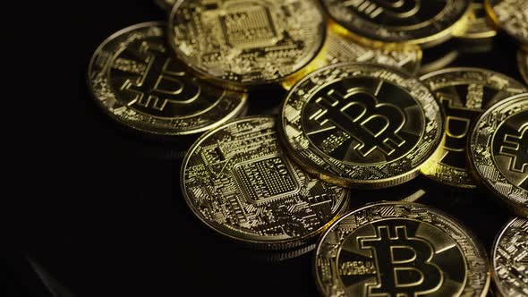 Rotating shot of Bitcoins (digital cryptocurrency) - BITCOIN 0589