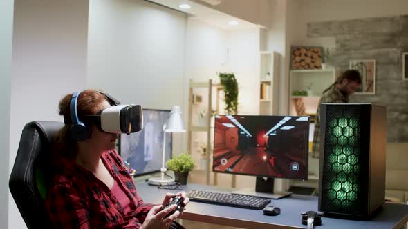 Side View of Woman with Red Hair Wearing Vr Goggles