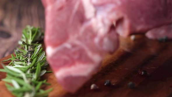 Close Up of Raw Meat on Chopping Board on a Chopping Board