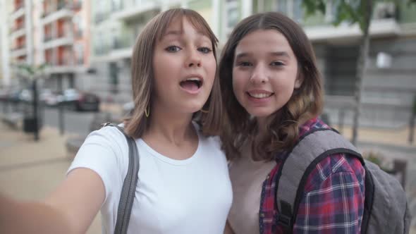 Joyful Teenage Bloggers Showing Thumbs Up Smiling Talking Looking at Camera