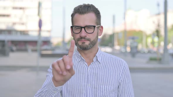 Rejecting Young Adult Man in Denial Standing Outdoor