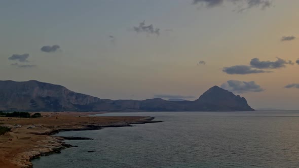 Panning view of beautiful Baia Santa Margherita bay of Macari in Sicily at sunset. Italy