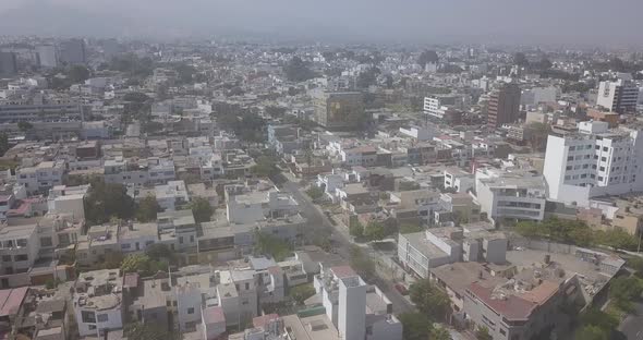 Aerial view of an empty coastal city during the day