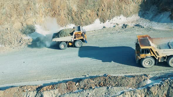 Copper Quarry Road with Two Trucks Moving Along It