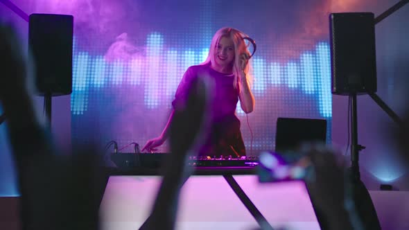 Blond Female DJ Dancing