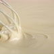 Stirring melted liquid white chocolate with steel whisk. Cooking chocolate dessert - VideoHive Item for Sale