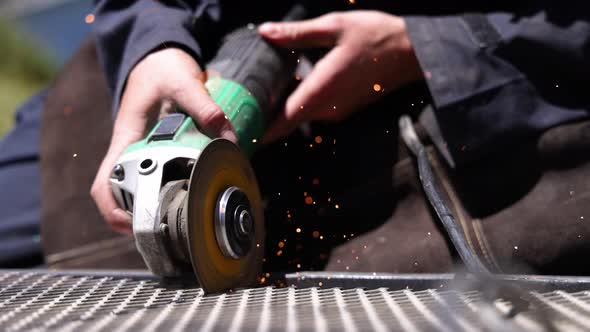 Female Hands Welding a Metal Surface