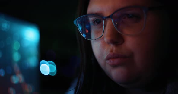 Young Adult Female Wearing Reflective Glasses Analyzing Cyber Security Code Data Working at Night Co