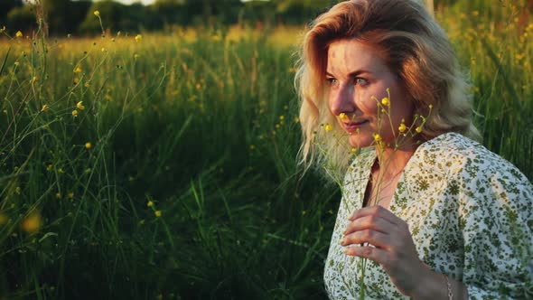 Young Woman Sitting in a Field