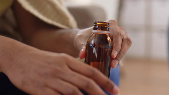 Ill Indian Man Taking Antipyretic Medicine at Home