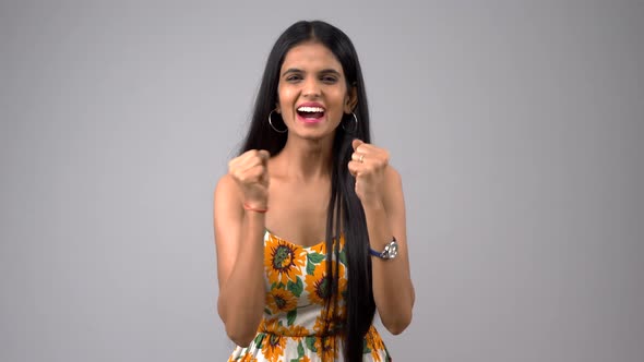 Happy Indian girl cheering