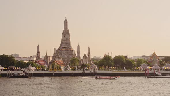 Thailand Bangkok Sunset River City Scene, Tourist Boat Trip Water Taxi and Buddhist Temple of Wat Ar